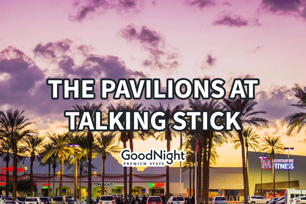 A vibrant exterior shot featuring palm trees and a bustling shopping center under a colorful sky. People are seen strolling, enjoying outdoor dining, and engaging in lively social interactions.